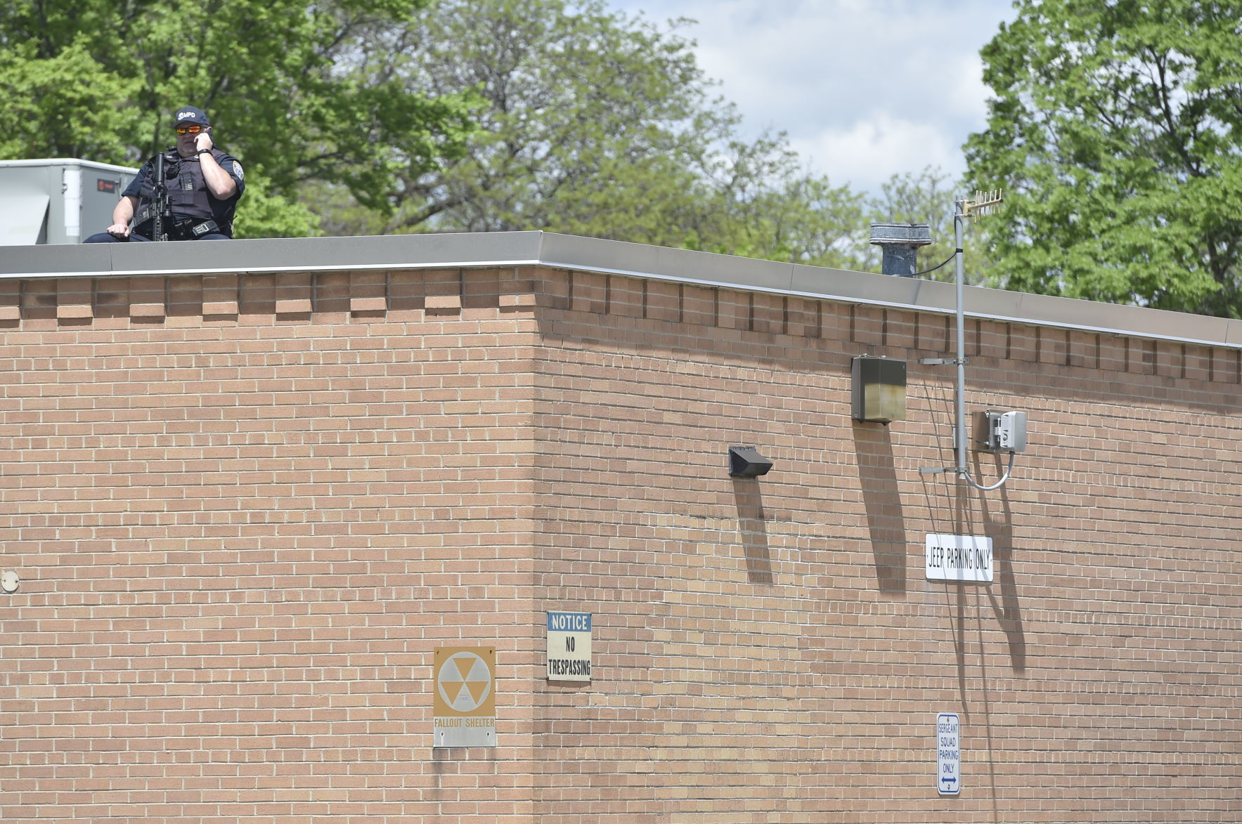 Police officer on top of District 5 of the MPD